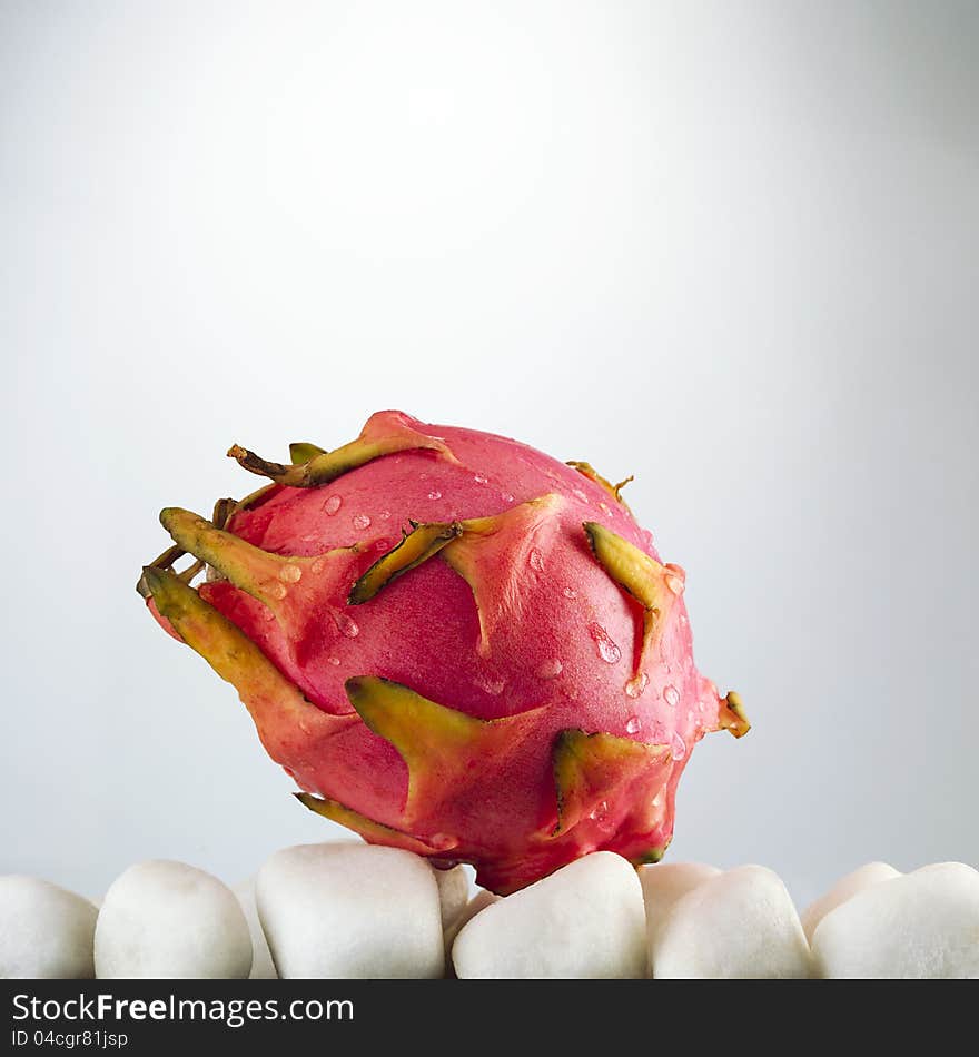 Pitaya - dragon fruit,on a background of white stones