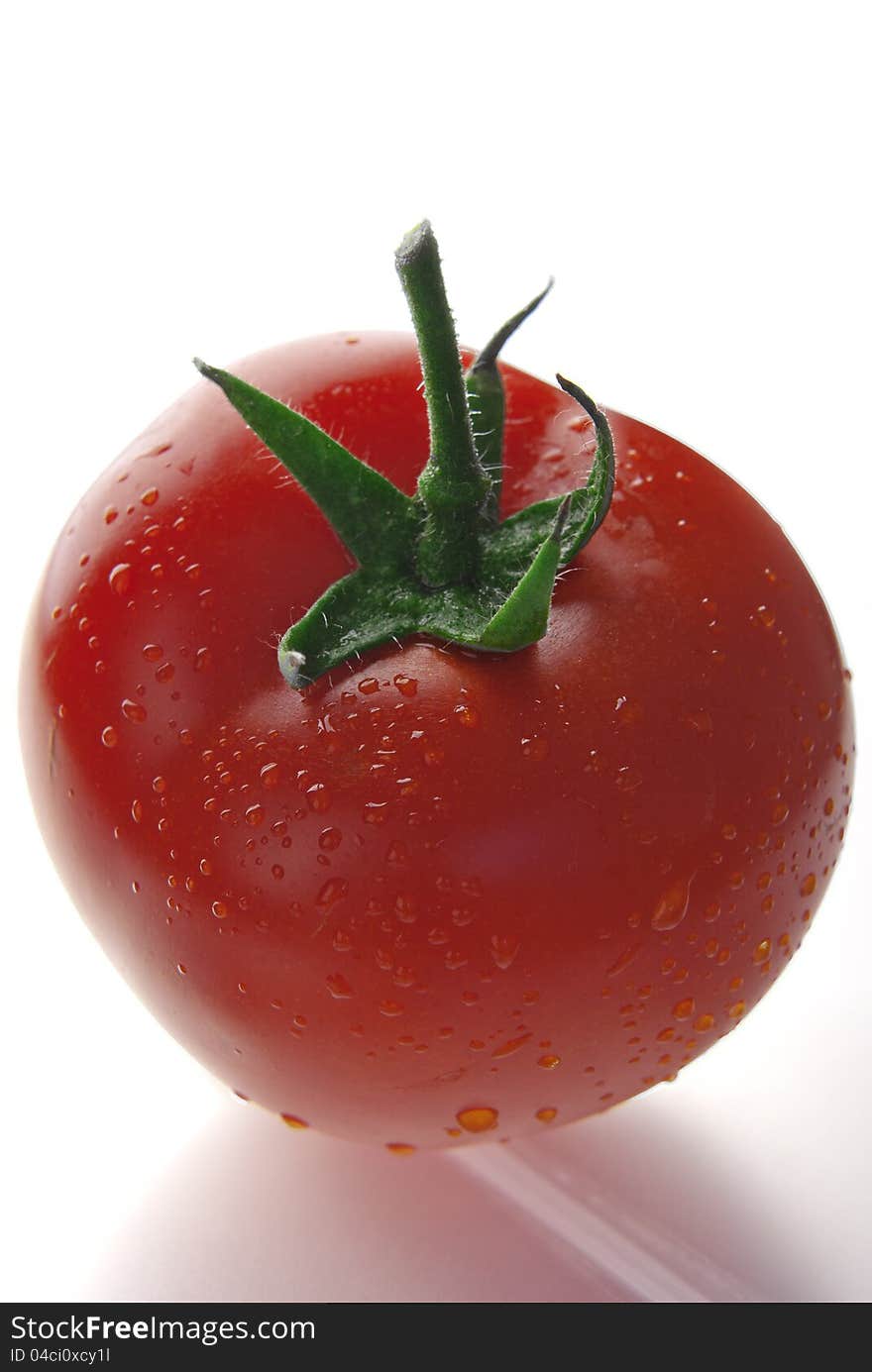 Close up of fresh red tomato  on white. Close up of fresh red tomato  on white