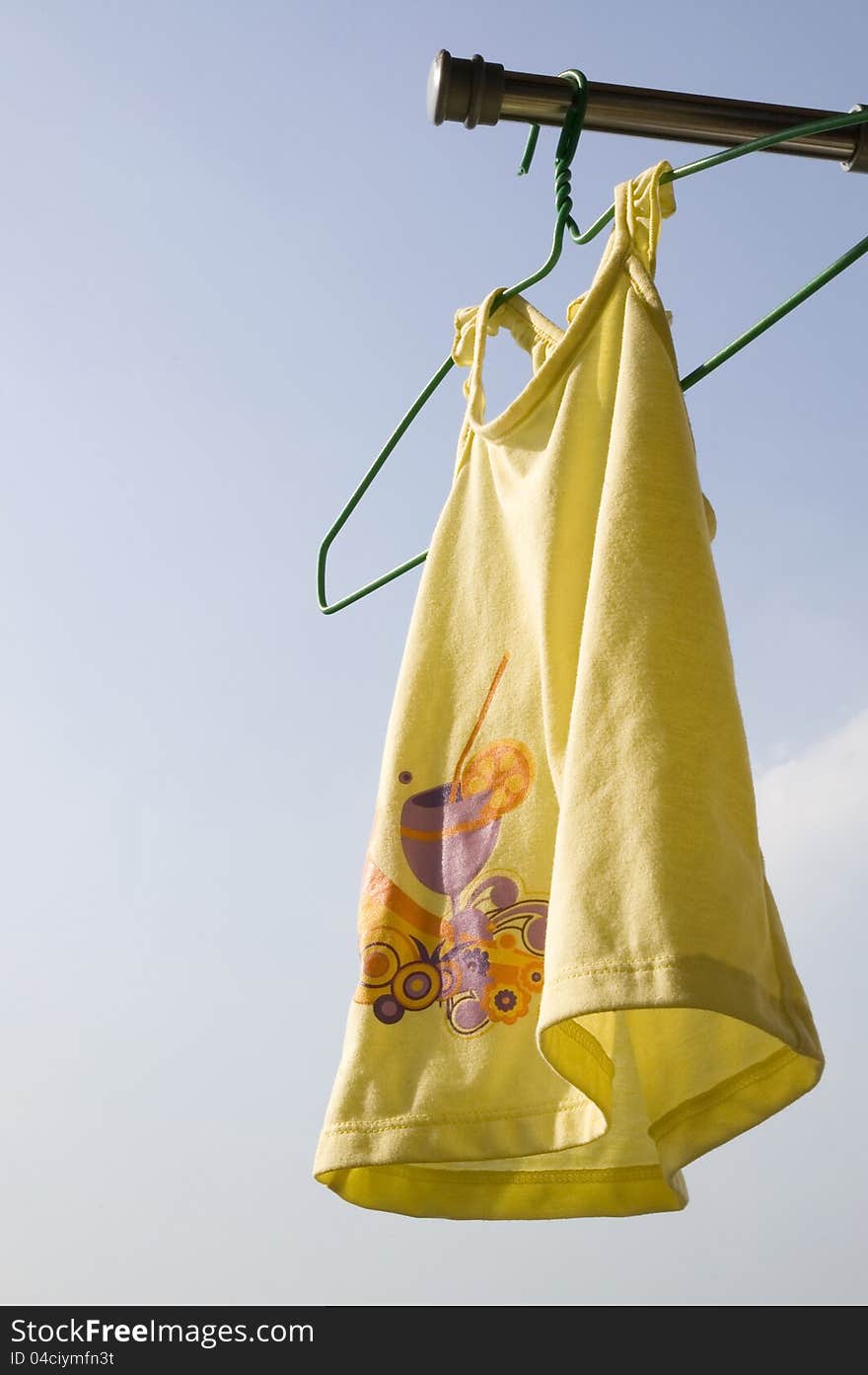 Yellow toddler cloth hanging to dry. Yellow toddler cloth hanging to dry