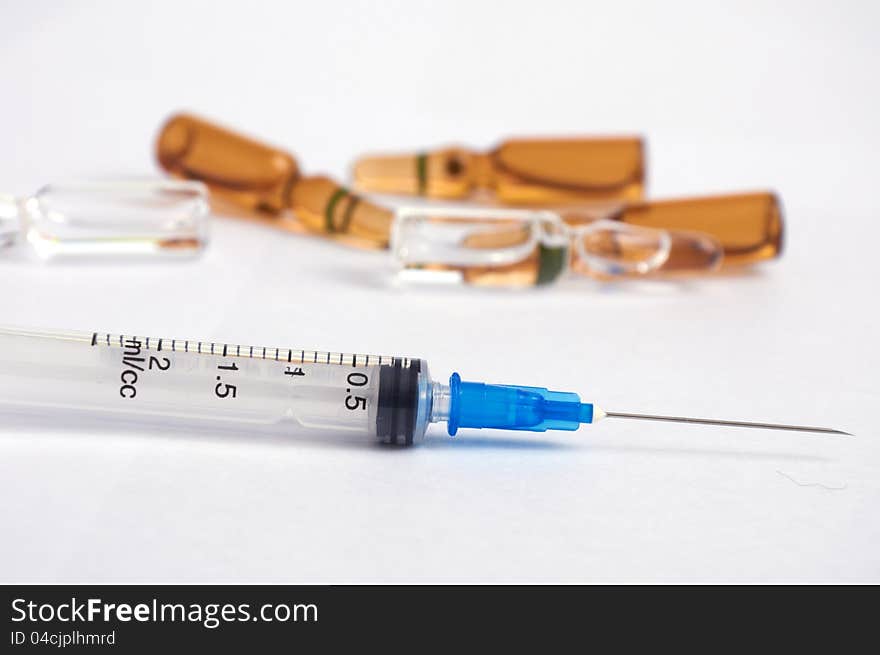 Disposable syringe and ampoules