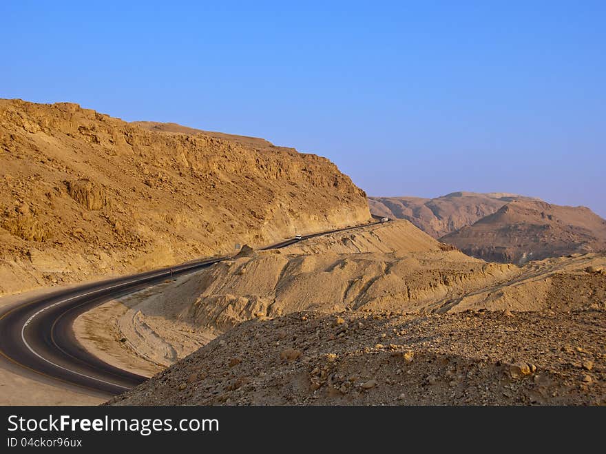 Mining paved road in the desert near the Dead Sea. Mining paved road in the desert near the Dead Sea