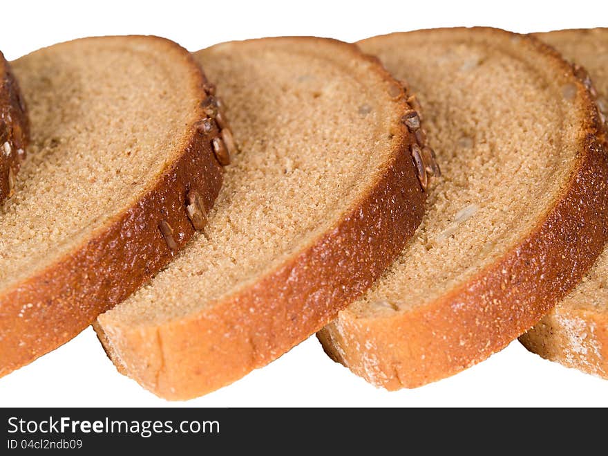 Slices of delicious bread with seeds isolated. Slices of delicious bread with seeds isolated