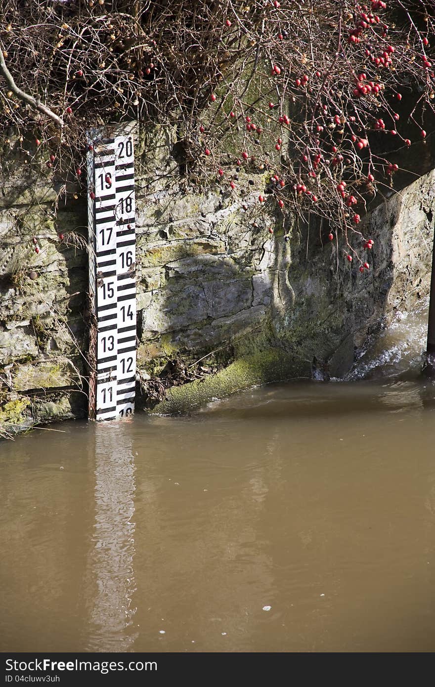 Scale for measuring water levels based on the stones. Scale for measuring water levels based on the stones