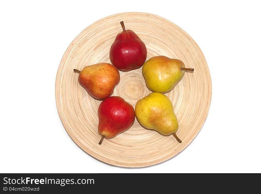 Fresh sweet williams pears on plate isolated