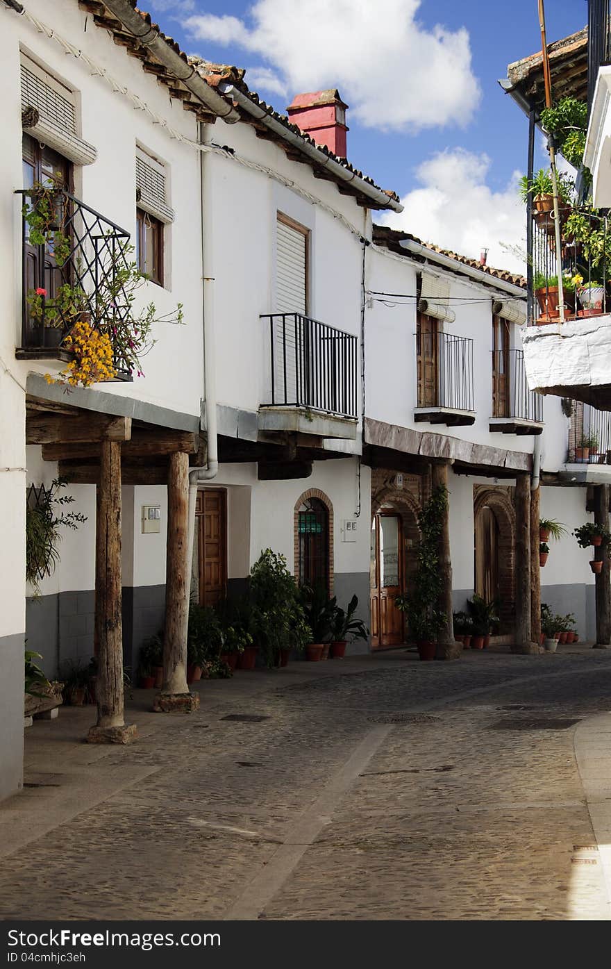 Narrow empty street in Guadalupe, Spain