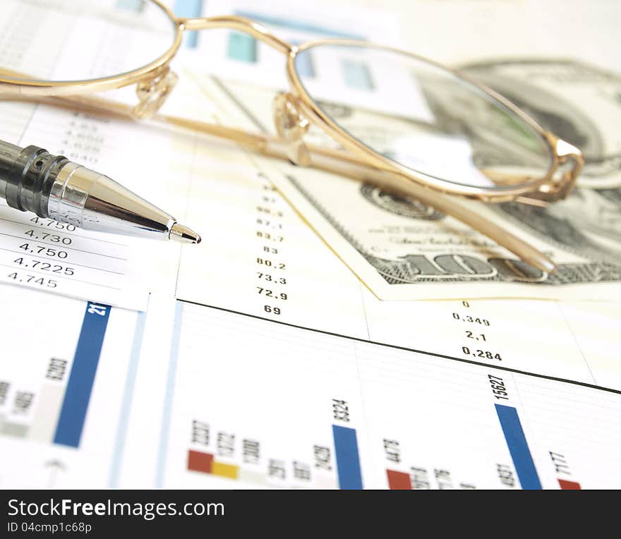 Chart with dollars,  glass and pen. Chart with dollars,  glass and pen