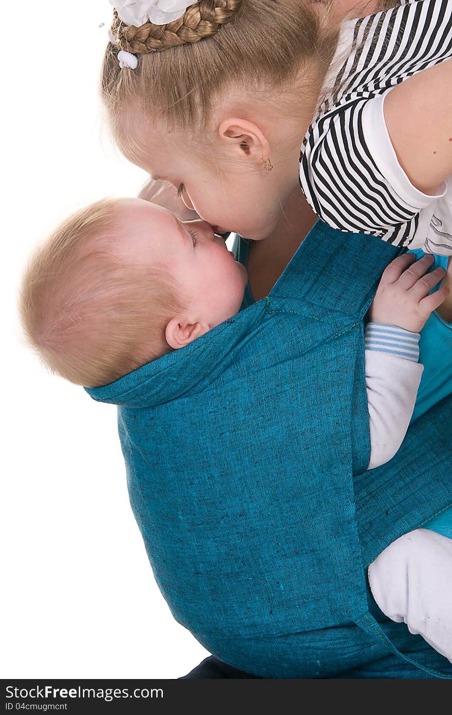 Sister kisses her little brother