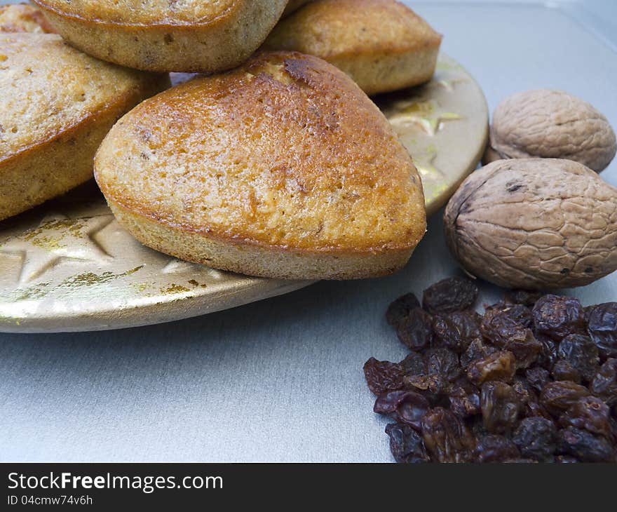 Cakes with raisins and coconut flour in the shape of the heart-close up. Cakes with raisins and coconut flour in the shape of the heart-close up