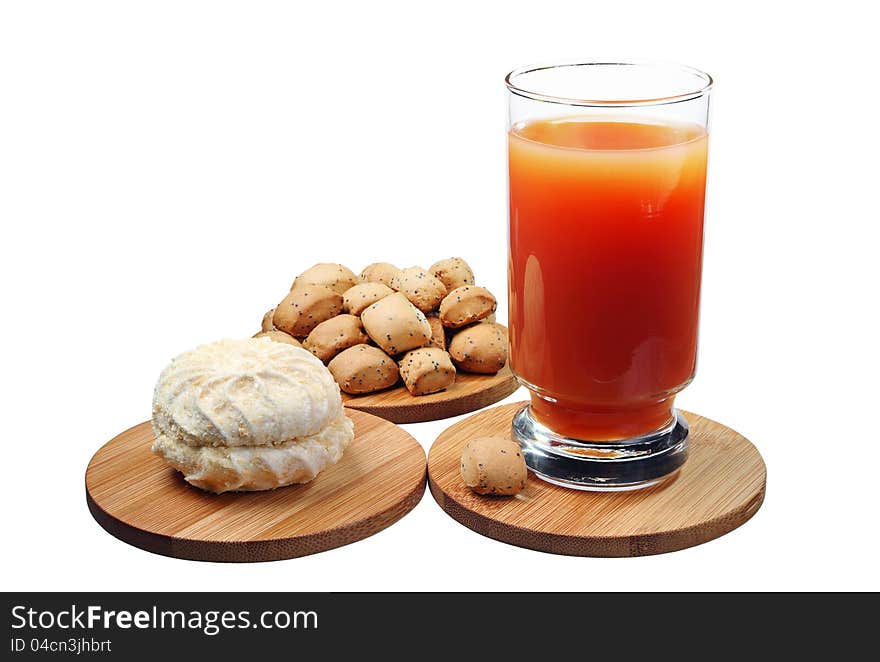 Sweet marshmallow with a glass of juice and small cookies isolated on white