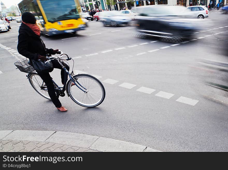 Cyclist waiting at the crossroads