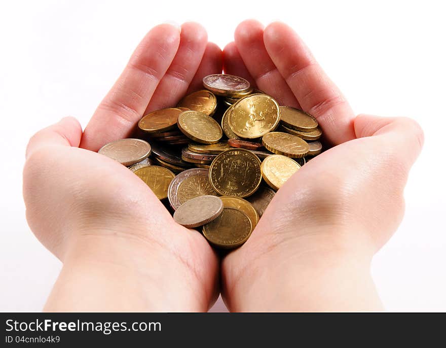 Female hands holding coins isolated. Female hands holding coins isolated