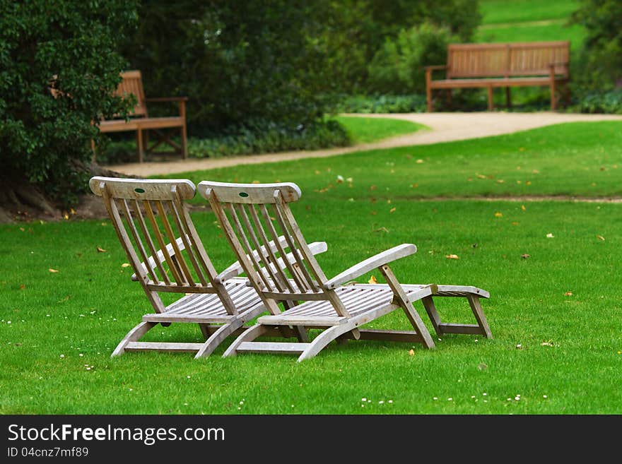 Two deckchairs in a park