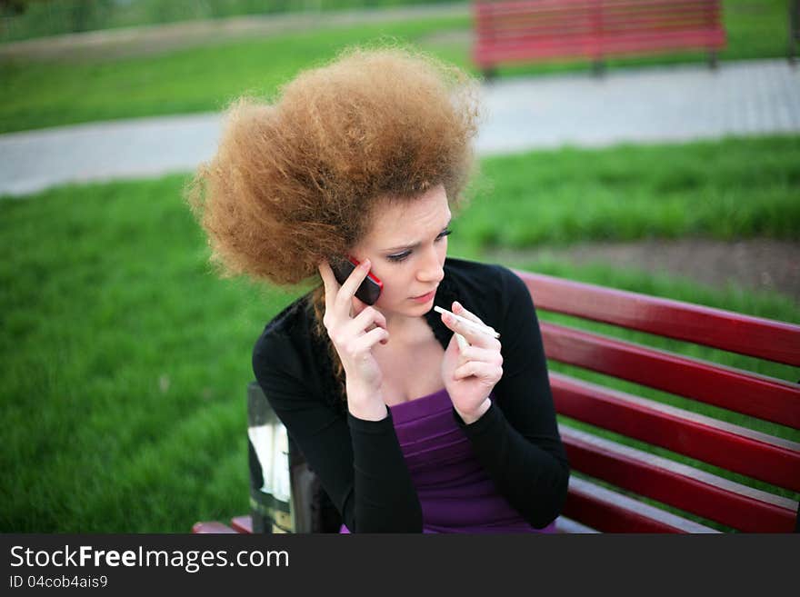 Girl talking on the phone and going through a nervous