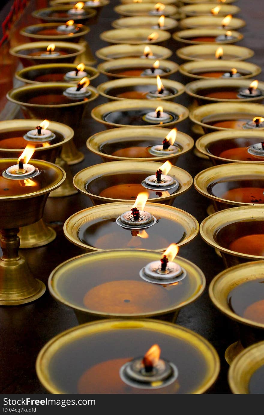 Candle lights of The Sichuan Emei Buddhist Temple in China.