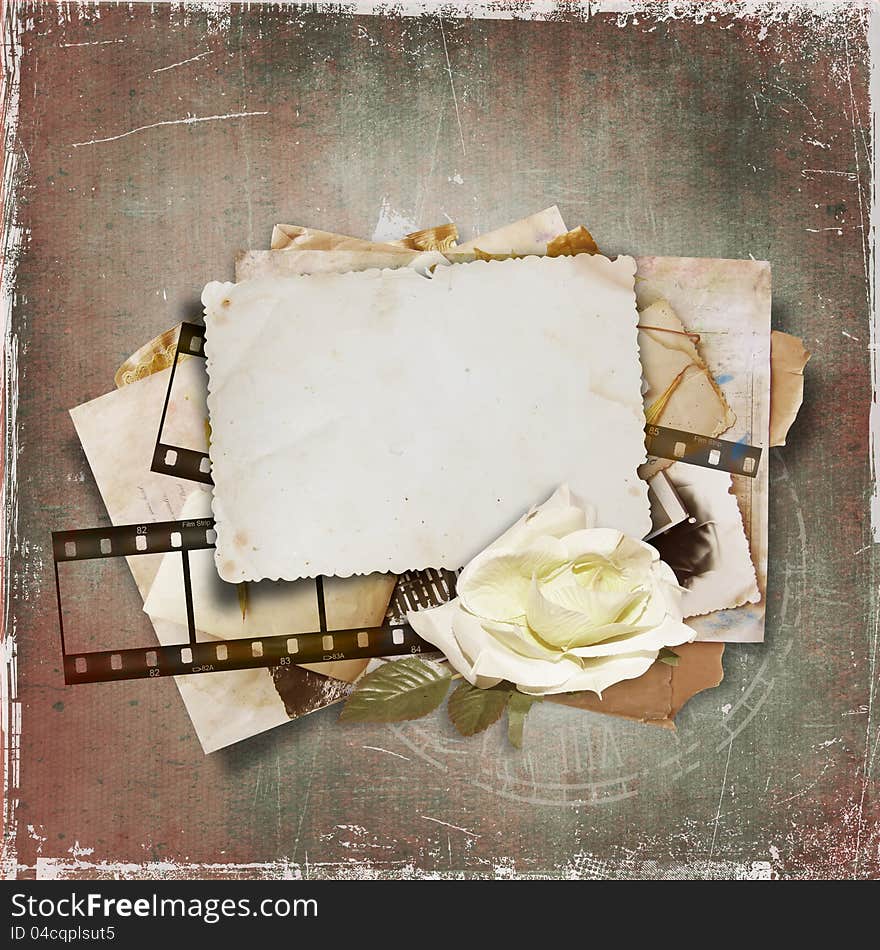 Vintage background with old card and film strip .page family album