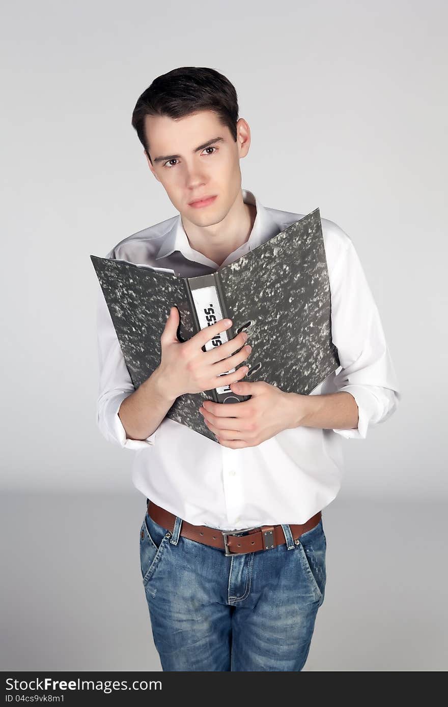 Young man with an office folder on white background