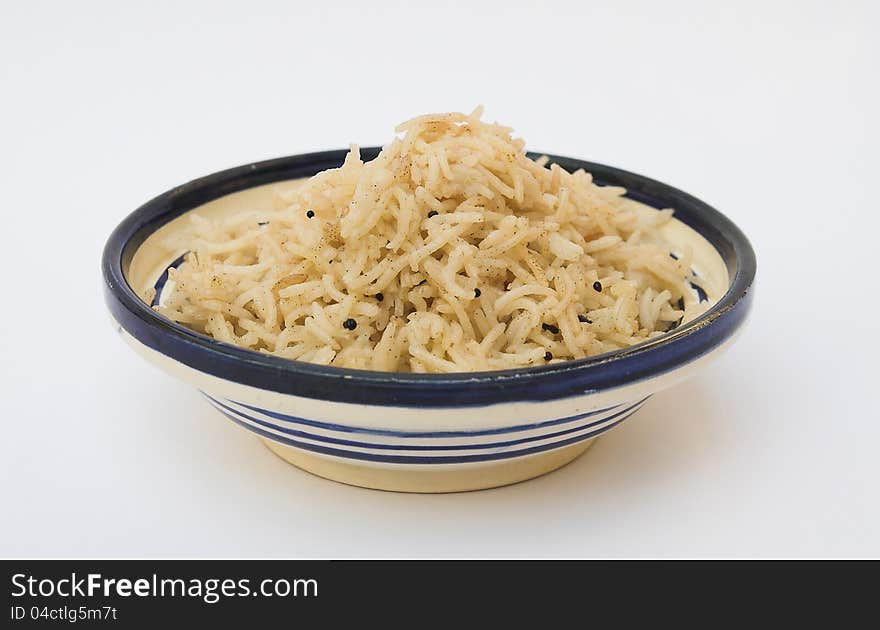 Little plate of basmati rice cooked with grains of charlock. Little plate of basmati rice cooked with grains of charlock