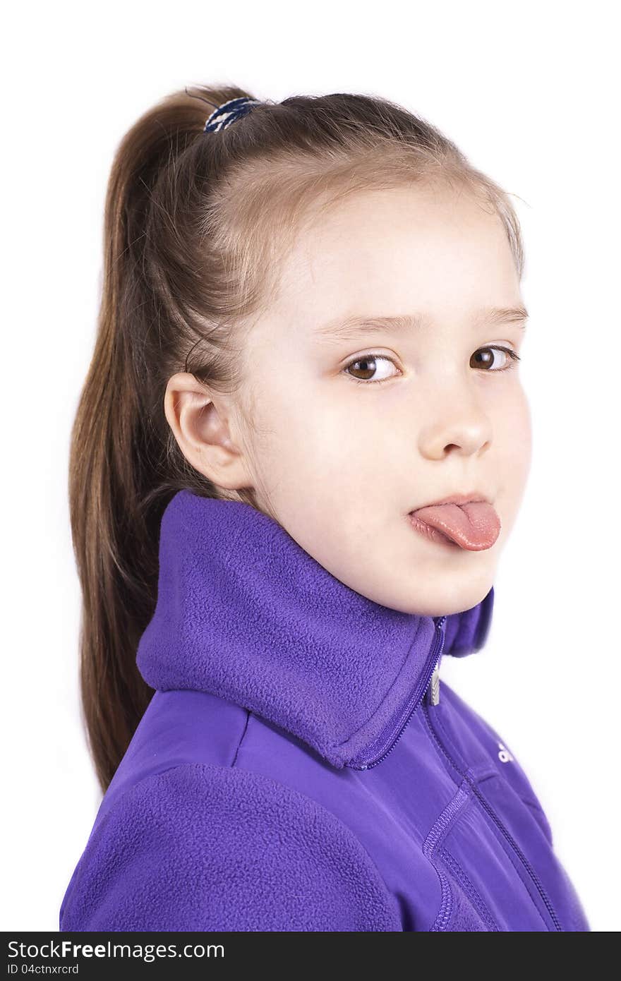 Little pretty girl with her tongue out, isolated on white background