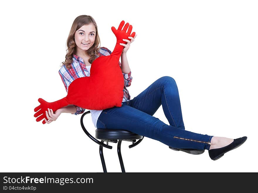 Beautiful girl with A red plush heart, isolate on white