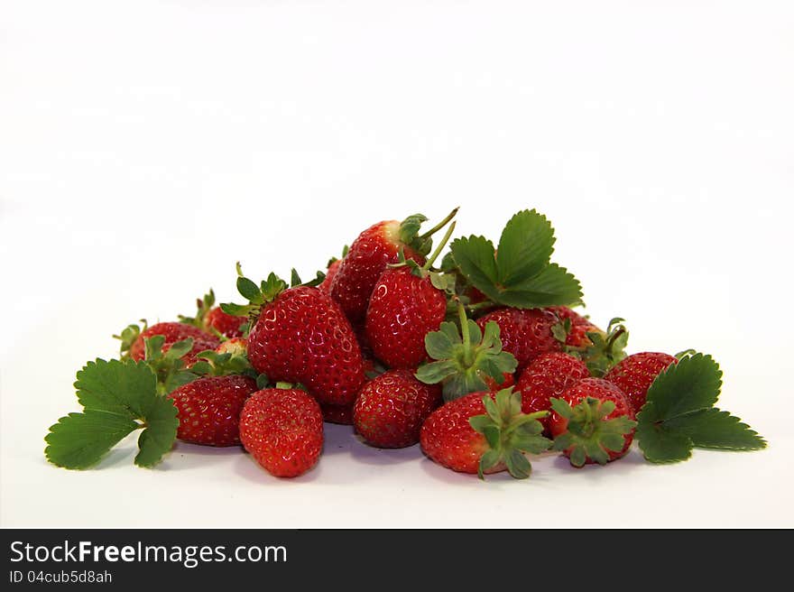 Fresh sweet strawberries with leaves on white background