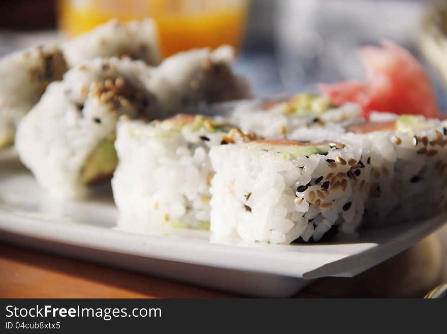 Tasty sushi - california rolls on white plate