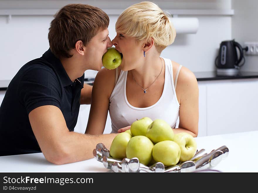 Happy couple posing in the kitchen