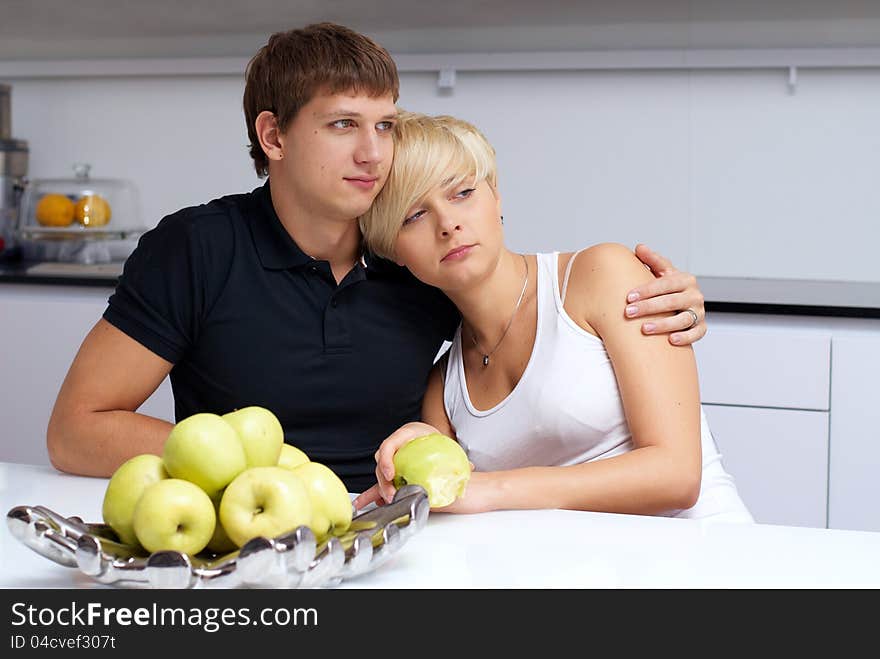 Happy couple posing in the kitchen