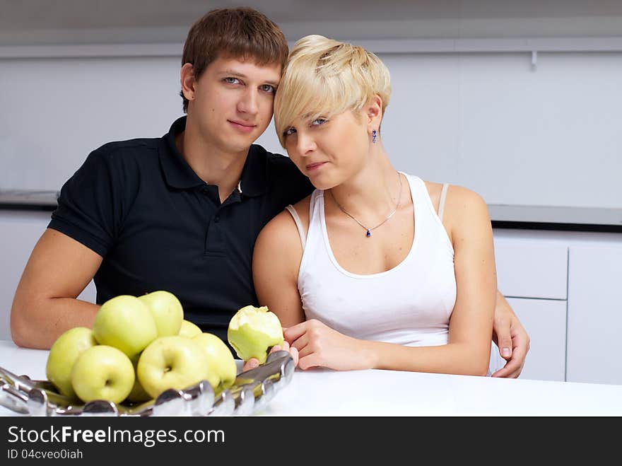 Happy couple posing in the kitchen