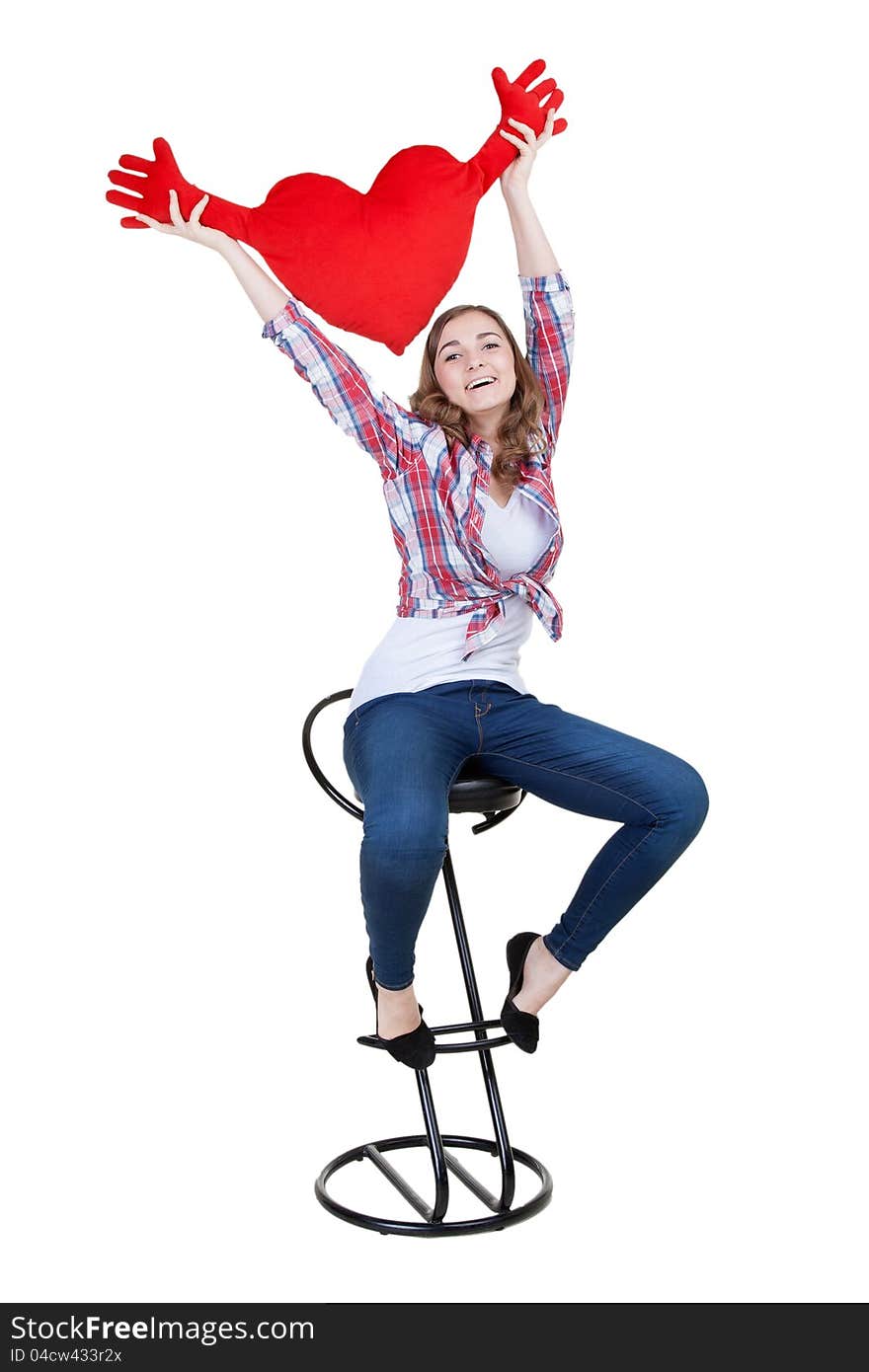 Beautiful girl with A red plush heart, isolate on white