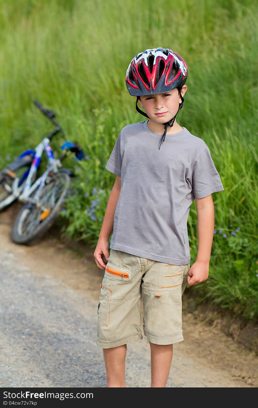 Portrait of boy bicyclist with helmet