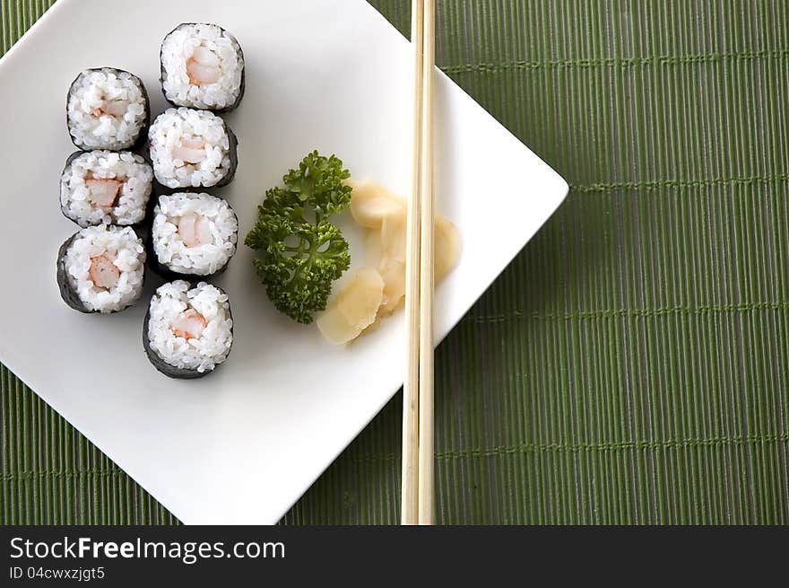 View on top of sushi set on green background