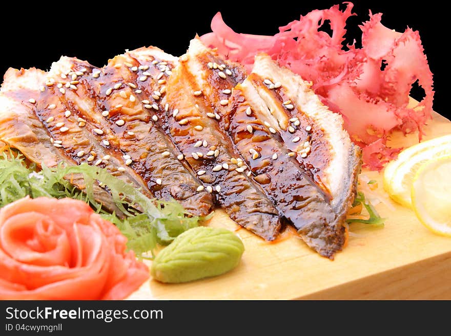 Sashimi unagi on a board closeup