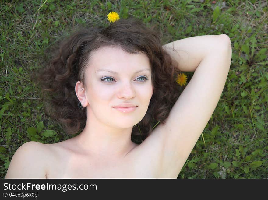 Young  Girl Lying On Grass