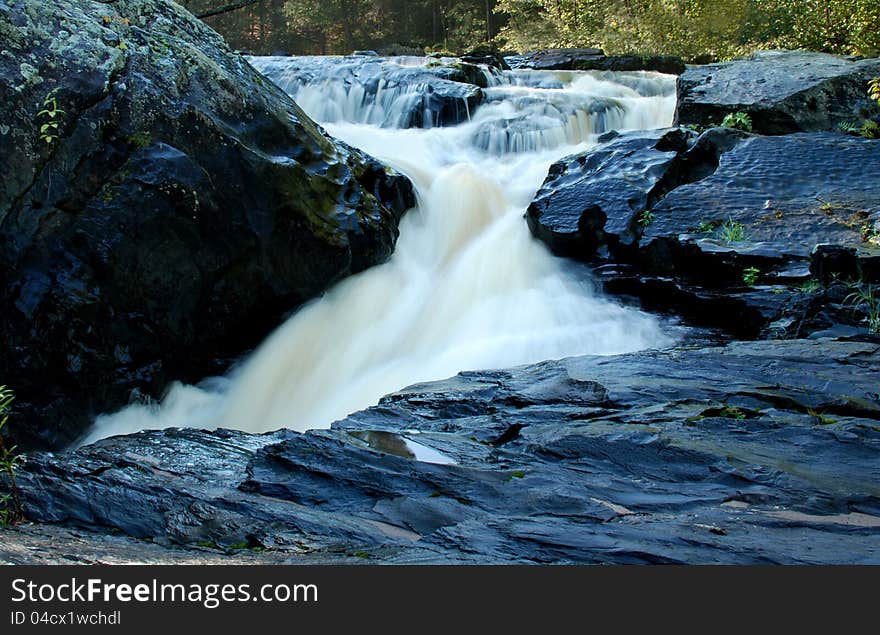 Water Fall Over Black Slate Rocks