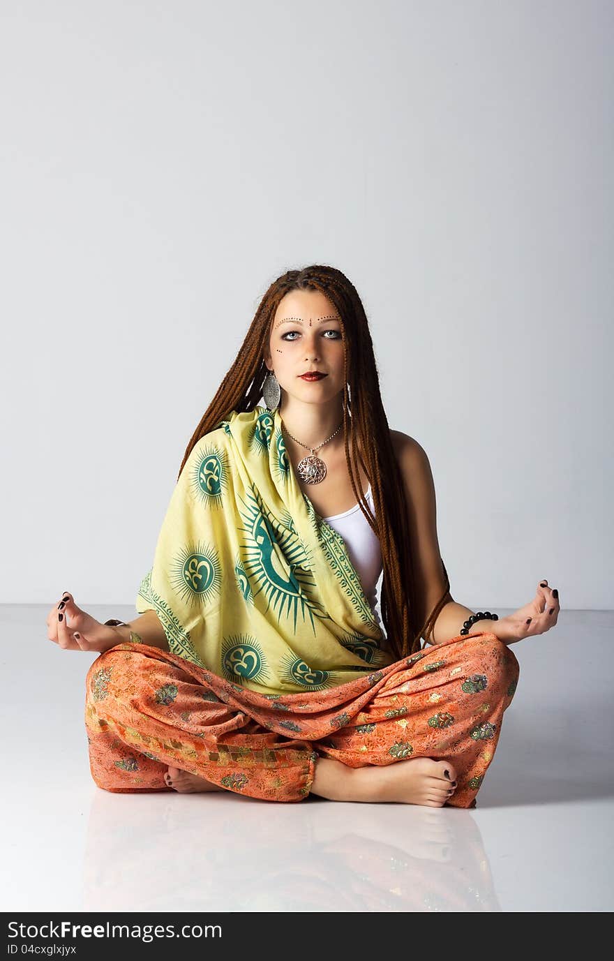 Young indian woman posing sitting on the floor