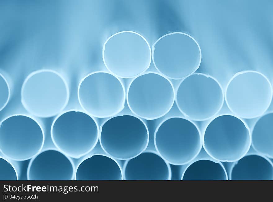 Drinking straw closeup. Blue color tone.