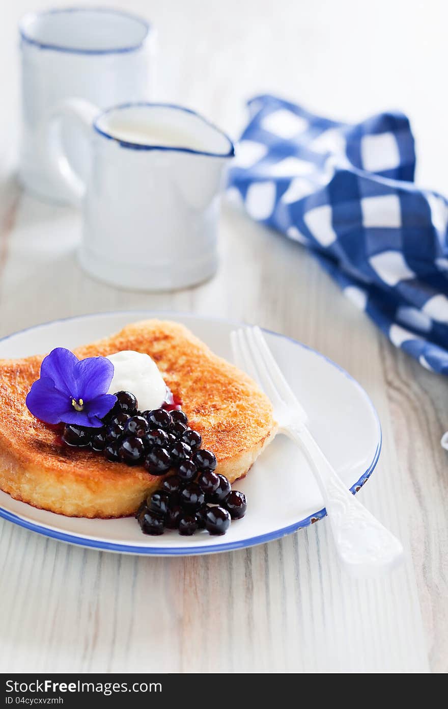 French toast with currant violet syrup for breakfast, selective focus