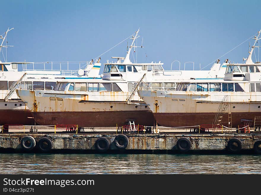 Abandoned boats in Yalta's harbor. Abandoned boats in Yalta's harbor