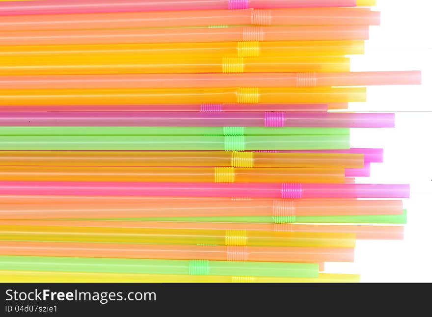 Many colored tubes for drinks on white background. Many colored tubes for drinks on white background