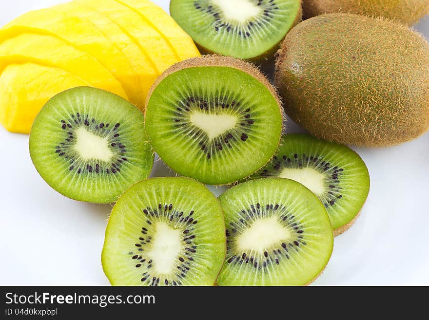 Kiwi and mango fruit on white background