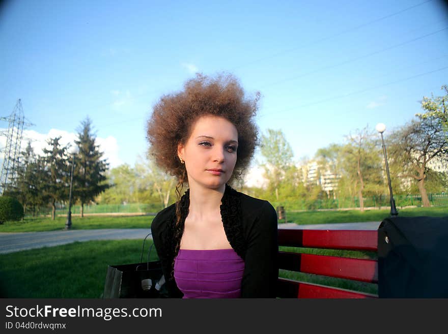 Curly girl portrait day with flowing hair. Curly girl portrait day with flowing hair