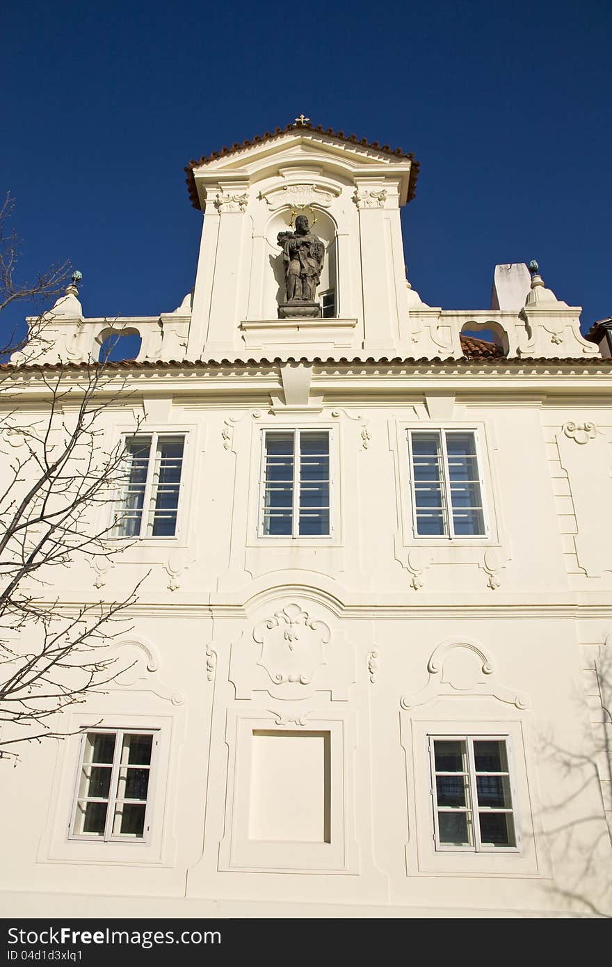 Town house in prague religious statue. Town house in prague religious statue