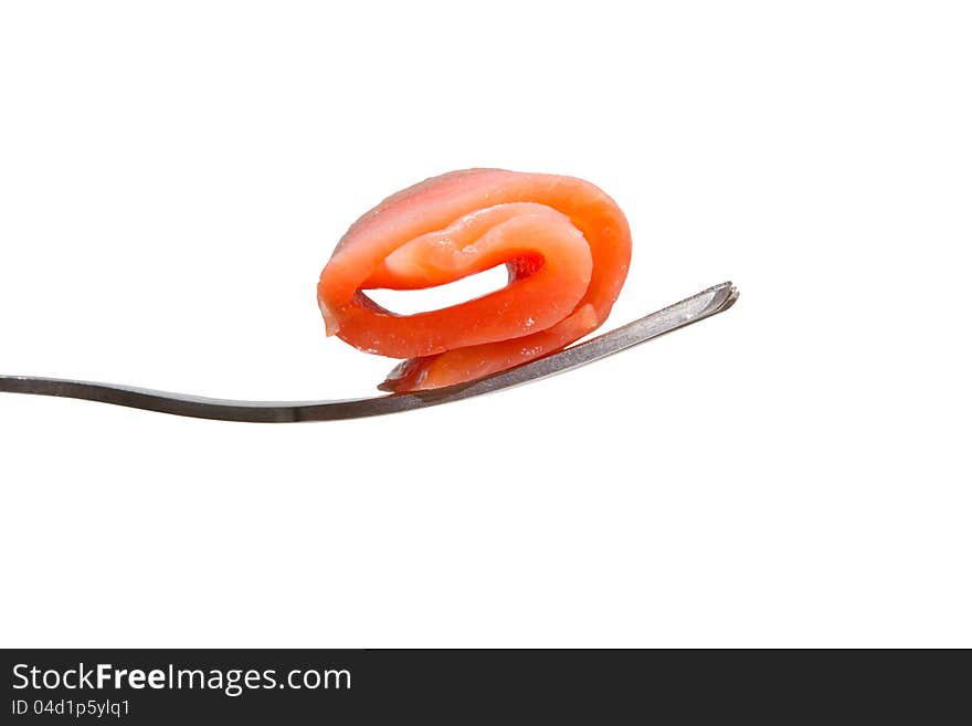 Roll of salmon slice on a fork, isolated on white