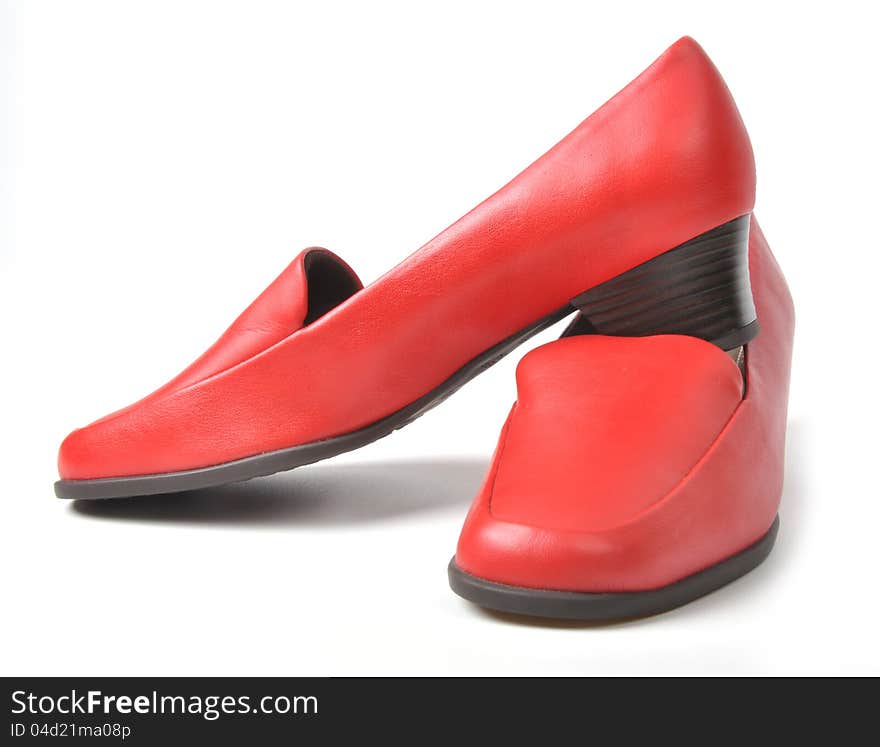 Red female shoes on white background. Red female shoes on white background