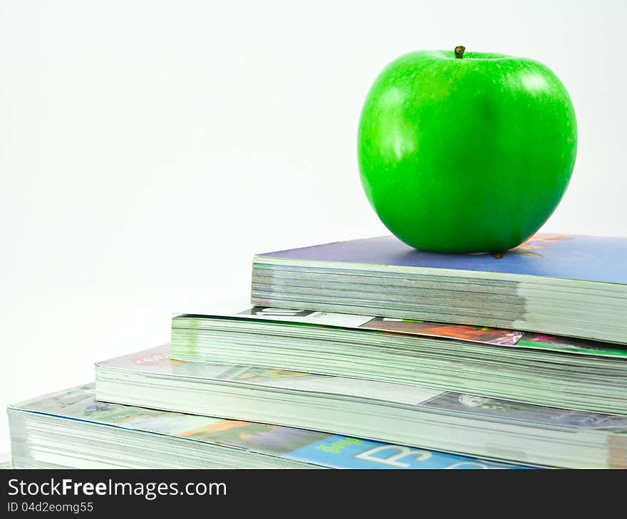 Books and an apple