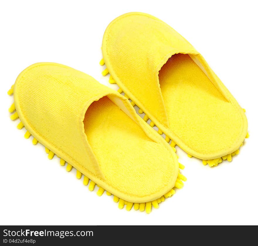 Yellow slippers isolated on a white background