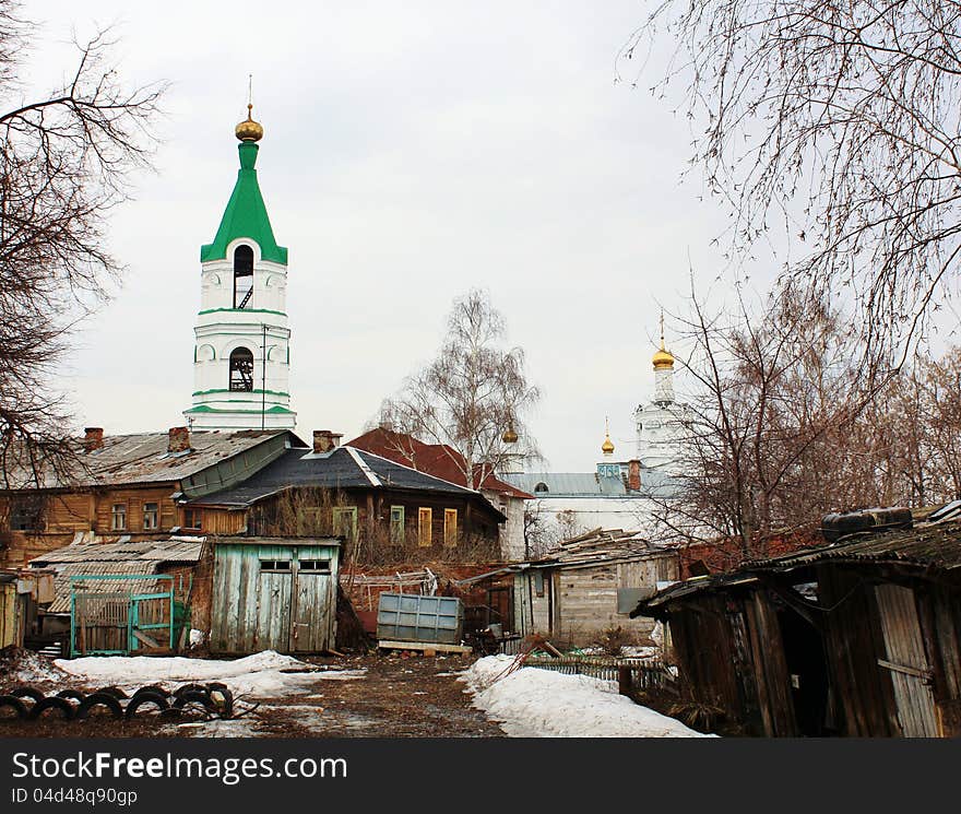 Old yard in the historic center of the central Russian city in  early spring. Old yard in the historic center of the central Russian city in  early spring