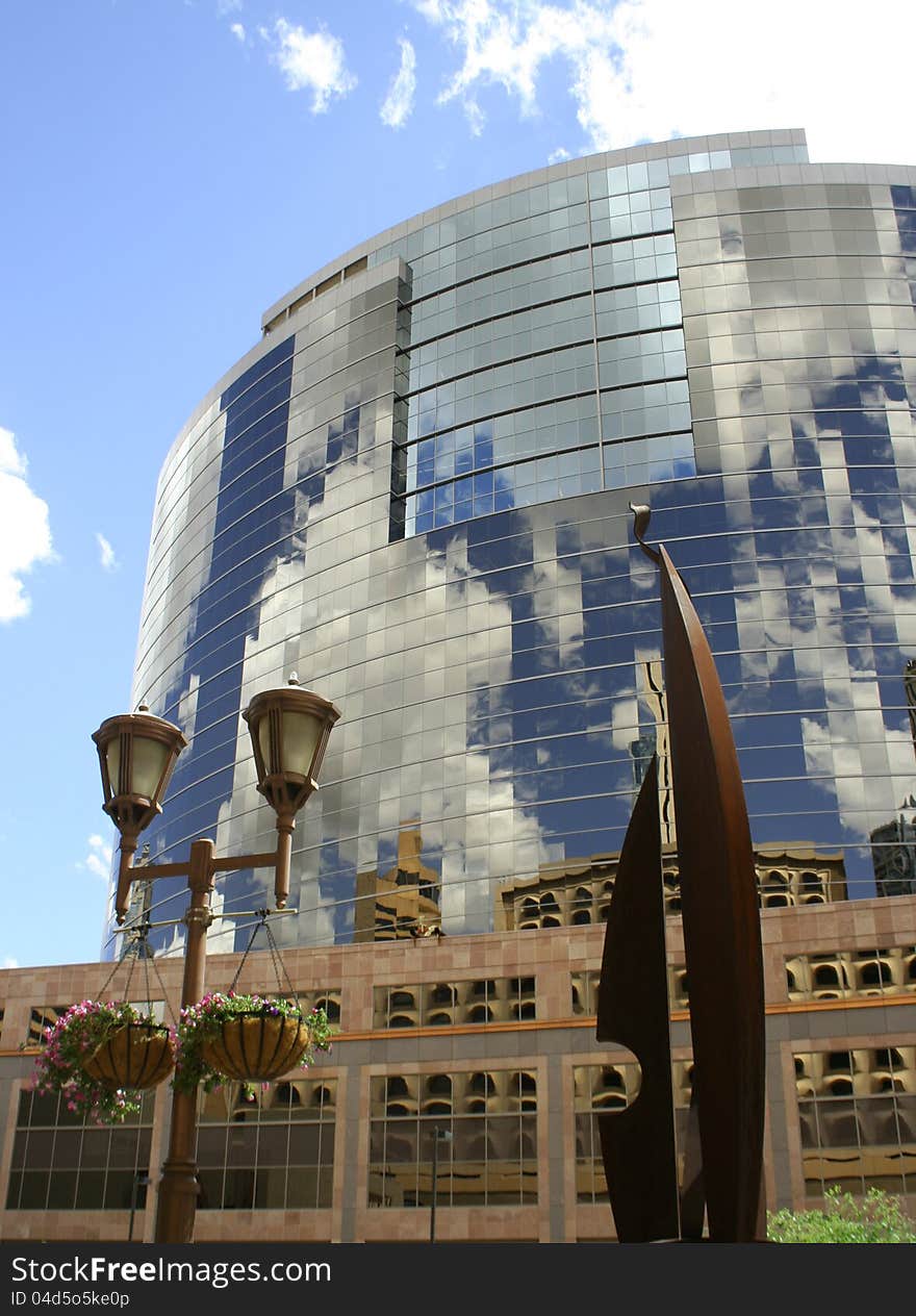 Other buildings reflecting onto 
windows of a tall skyscrapper. Other buildings reflecting onto 
windows of a tall skyscrapper