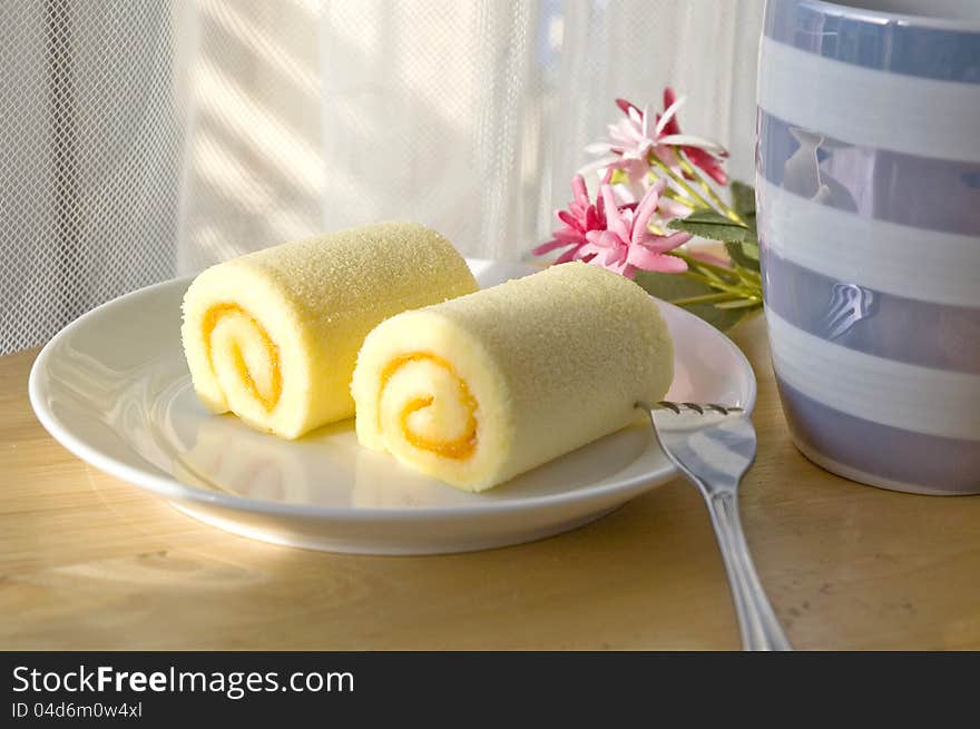 Roll cake on plate