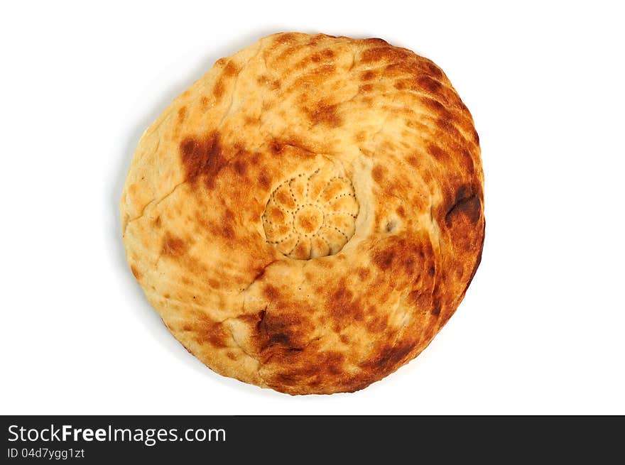 Hand-made Caucasian bread on white background with shadow